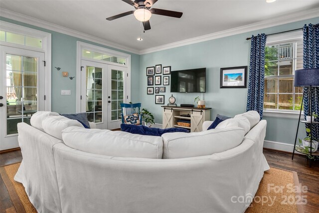 living room featuring french doors, wood finished floors, a ceiling fan, crown molding, and baseboards