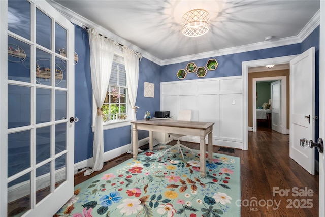 office area featuring baseboards, wood finished floors, and crown molding