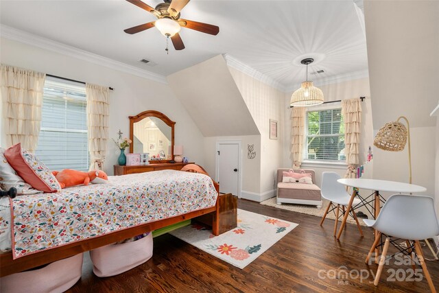 bedroom with wood finished floors, crown molding, ceiling fan, and baseboards