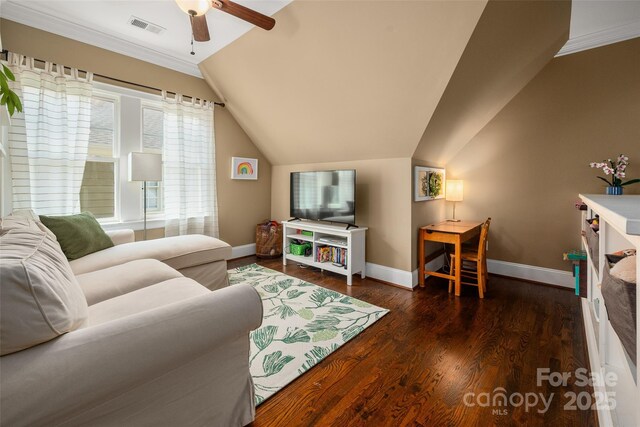 living room featuring baseboards, ceiling fan, lofted ceiling, wood finished floors, and crown molding