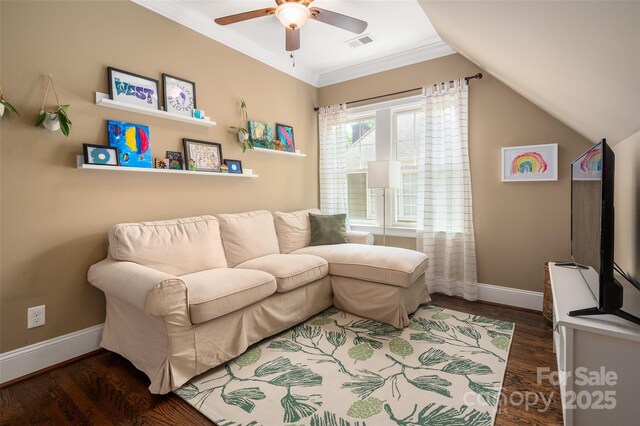 living area with a ceiling fan, baseboards, wood finished floors, ornamental molding, and lofted ceiling