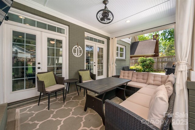 sunroom with french doors and an outdoor hangout area