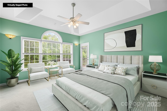 carpeted bedroom with multiple windows, baseboards, and ceiling fan
