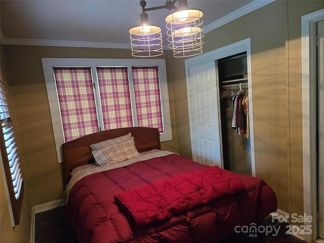 bedroom featuring a chandelier, crown molding, and a closet