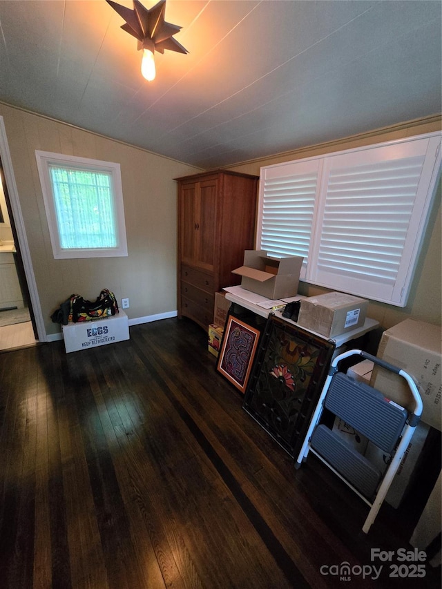 office area with dark wood-style flooring and lofted ceiling