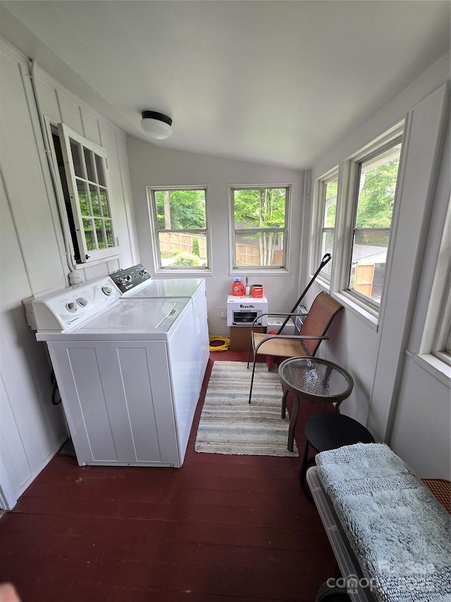 laundry room with dark wood-style flooring, laundry area, and washer and dryer