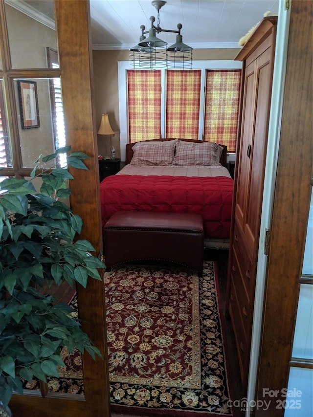132 Sycamore Ter, Arden, NC 28704 - bedroom with ornamental molding and a chandelier