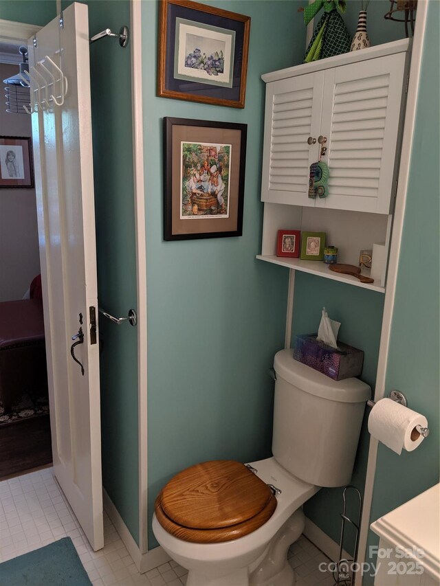 132 Sycamore Ter, Arden, NC 28704 - bathroom featuring toilet, tile patterned flooring, and baseboards