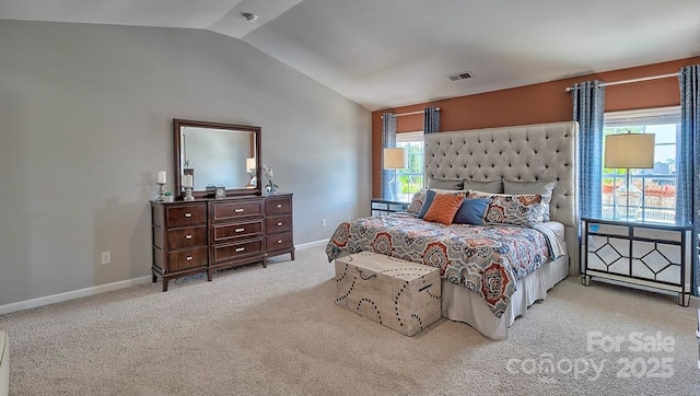 carpeted bedroom with visible vents, baseboards, and lofted ceiling