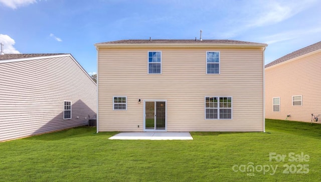 rear view of house featuring a patio and a lawn
