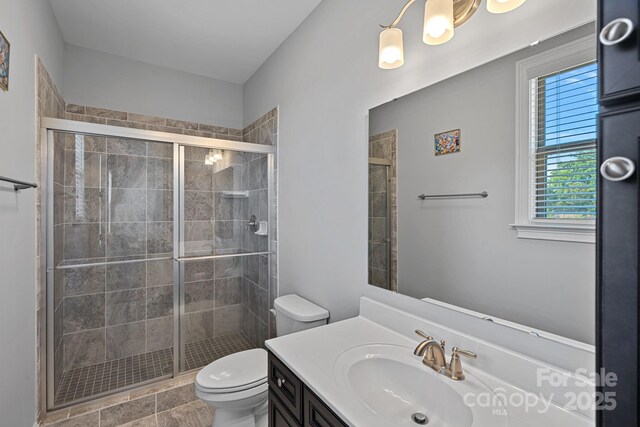 409 Wheatberry Hill Dr, Matthews, NC 28104 - full bathroom with toilet, a shower stall, and vanity