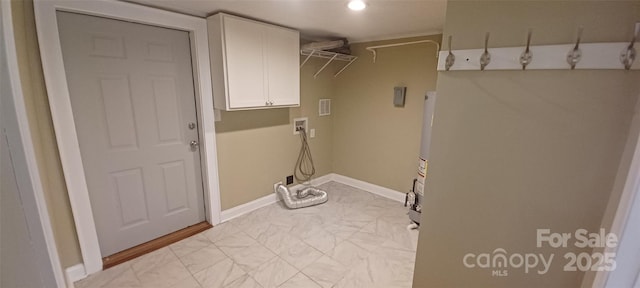 615 Grier St, Lincolnton, NC 28092 - washroom featuring cabinet space, washer hookup, baseboards, and light marble finish floors