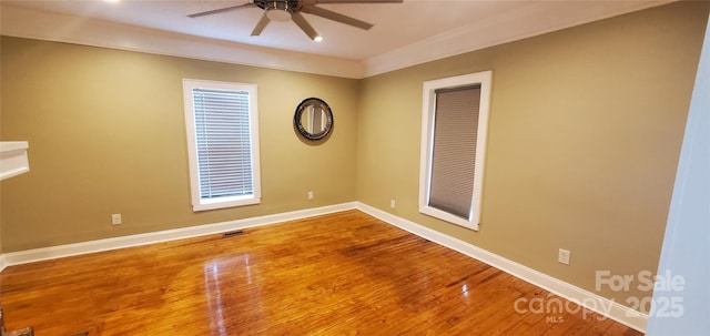 615 Grier St, Lincolnton, NC 28092 - spare room featuring a ceiling fan, wood finished floors, and baseboards