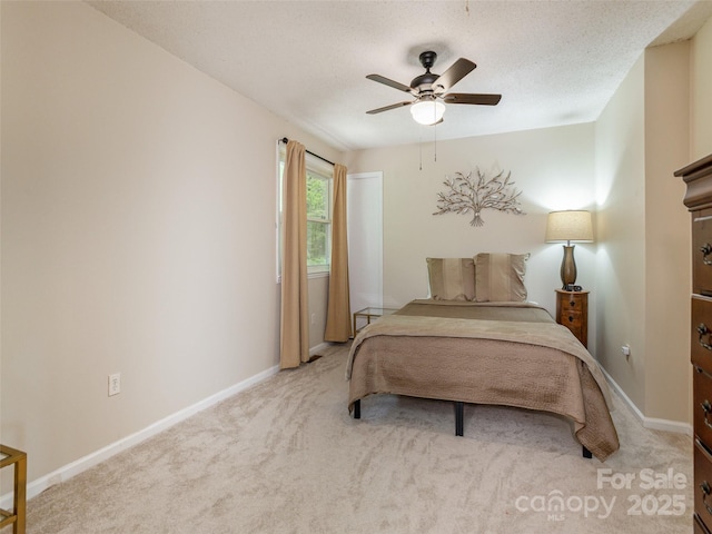 bedroom featuring carpet, baseboards, and ceiling fan