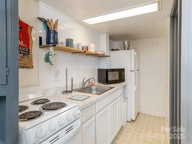kitchen with a sink, white range with electric cooktop, black microwave, white cabinetry, and open shelves