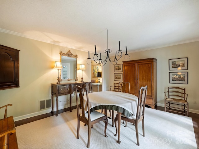dining space featuring ornamental molding and baseboards