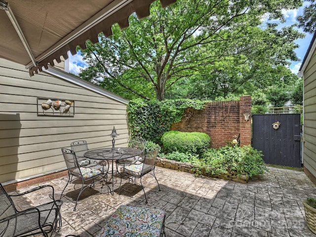 view of patio / terrace featuring outdoor dining space and fence