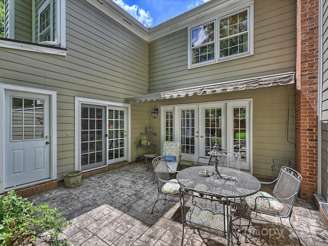 view of patio / terrace featuring french doors and outdoor dining area