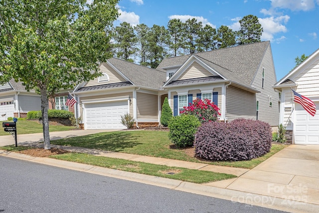 2035 Moultrie Ct, Fort Mill, SC 29707 - view of front of property featuring a standing seam roof, a garage, driveway, a shingled roof, and a front lawn