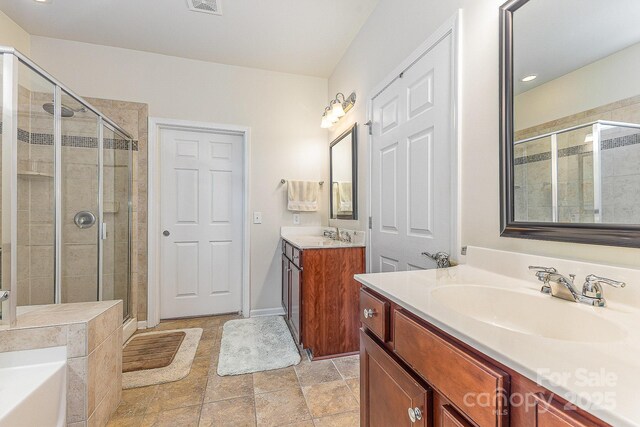 2035 Moultrie Ct, Fort Mill, SC 29707 - full bathroom with a stall shower, two vanities, and a bath