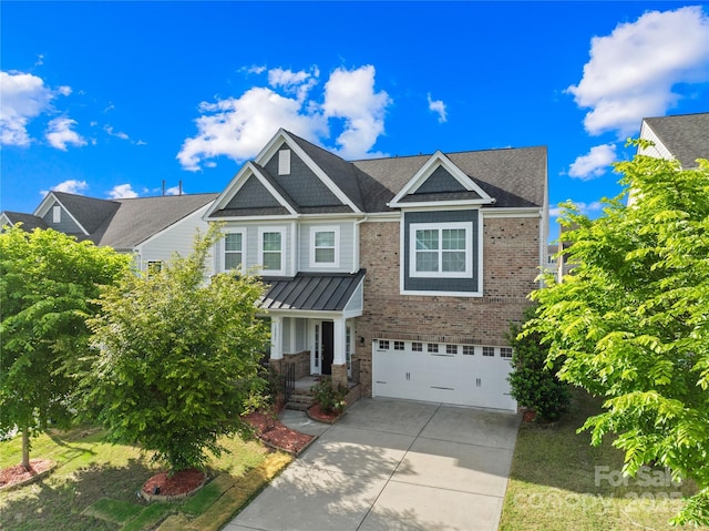 craftsman-style house featuring concrete driveway and a garage