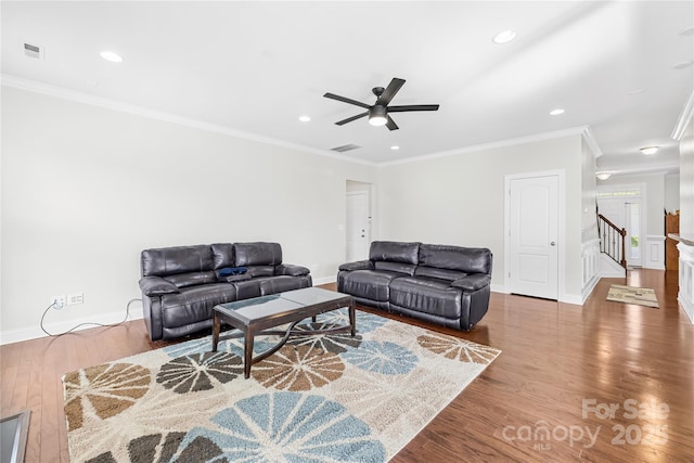 living room with wood finished floors, ceiling fan, recessed lighting, ornamental molding, and stairway