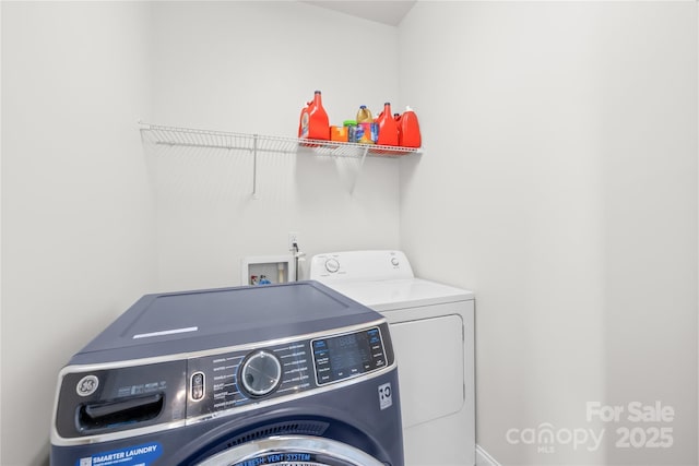laundry room with washer and clothes dryer