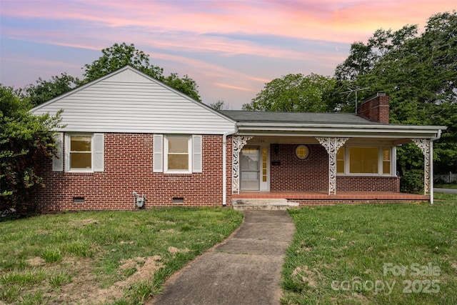 506 7th St SW, Hickory, NC 28602 - bungalow-style home featuring crawl space, a chimney, a front lawn, and covered porch