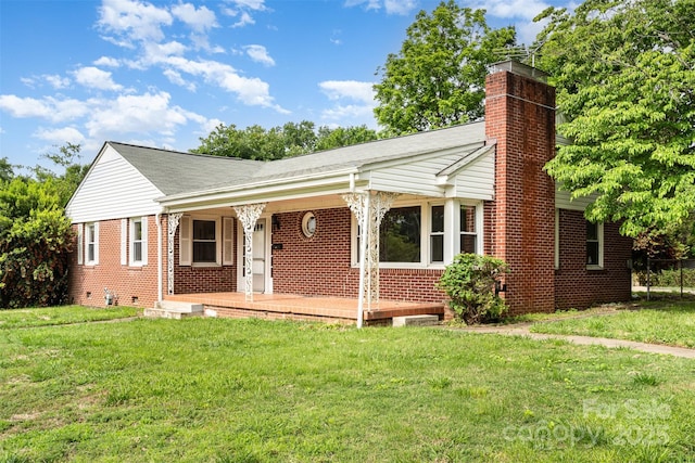 506 7th St SW, Hickory, NC 28602 - view of front facade featuring brick siding, a chimney, a front lawn, and covered porch