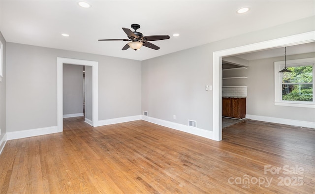 506 7th St SW, Hickory, NC 28602 - spare room featuring ceiling fan, baseboards, recessed lighting, and light wood-style flooring