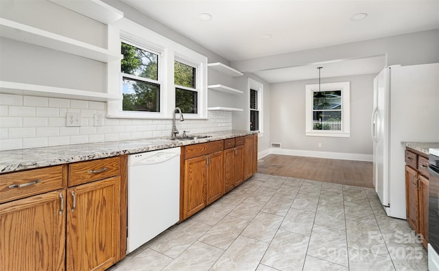 506 7th St SW, Hickory, NC 28602 - kitchen featuring open shelves, white appliances, a sink, brown cabinets, and tasteful backsplash