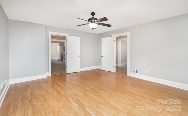 506 7th St SW, Hickory, NC 28602 - empty room with ceiling fan, baseboards, and light wood-type flooring