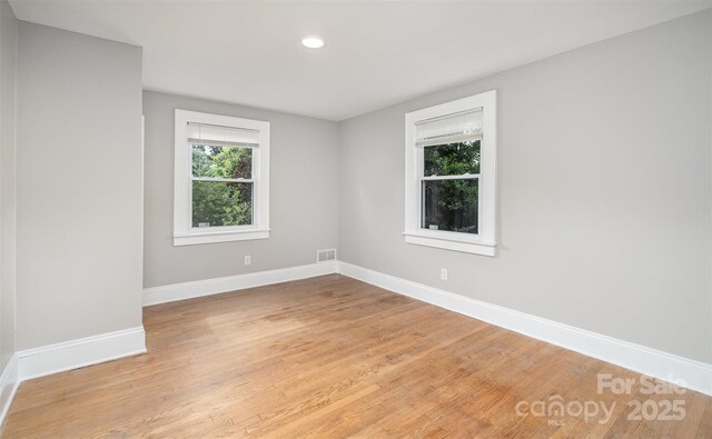 506 7th St SW, Hickory, NC 28602 - spare room featuring healthy amount of natural light, baseboards, light wood-type flooring, and recessed lighting