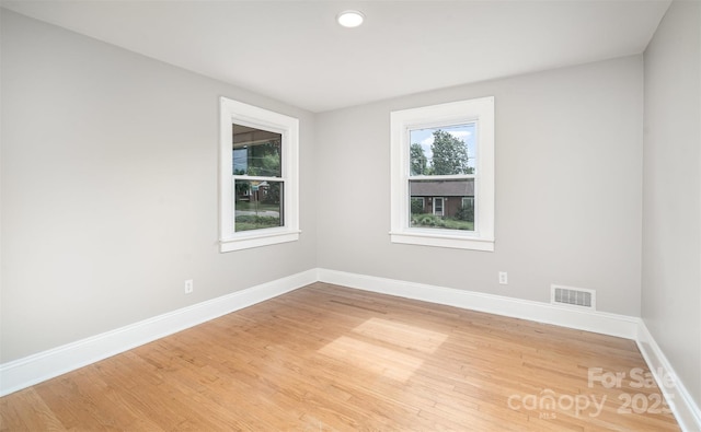 506 7th St SW, Hickory, NC 28602 - empty room with light wood-style floors, baseboards, and recessed lighting