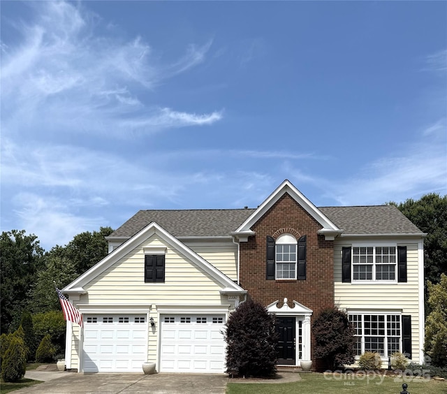 2330 Winthorp Ridge Rd, Charlotte, NC 28270 - view of front of house featuring driveway, a shingled roof, a garage, and brick siding