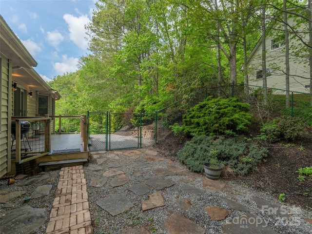 view of patio / terrace featuring a gate and fence