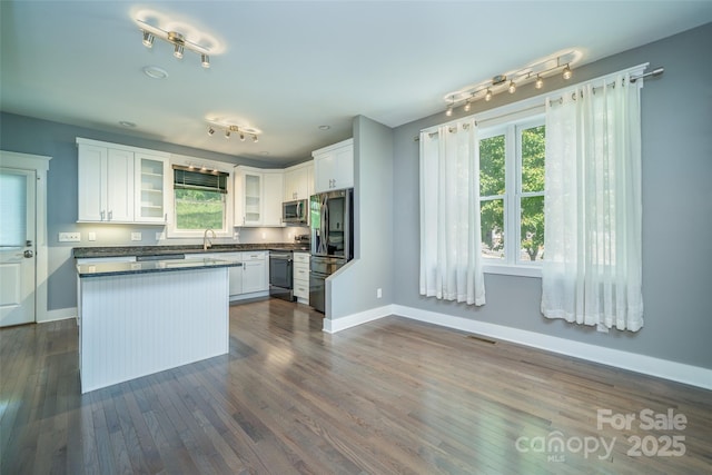 21 Bryant St, Asheville, NC 28806 - kitchen featuring stainless steel appliances, baseboards, and plenty of natural light