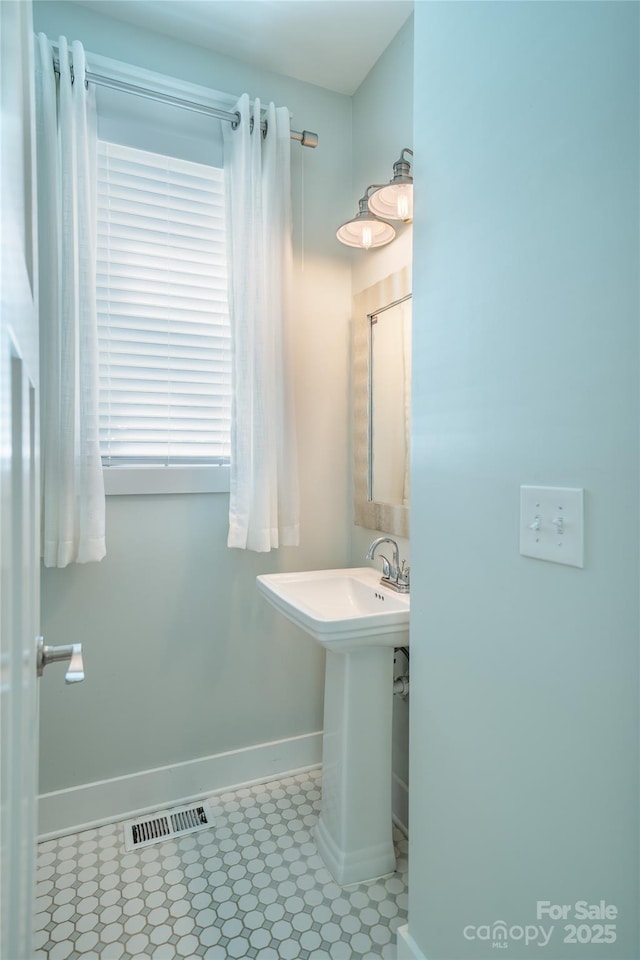 21 Bryant St, Asheville, NC 28806 - bathroom featuring baseboards