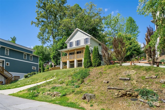21 Bryant St, Asheville, NC 28806 - rear view of house featuring a balcony and board and batten siding