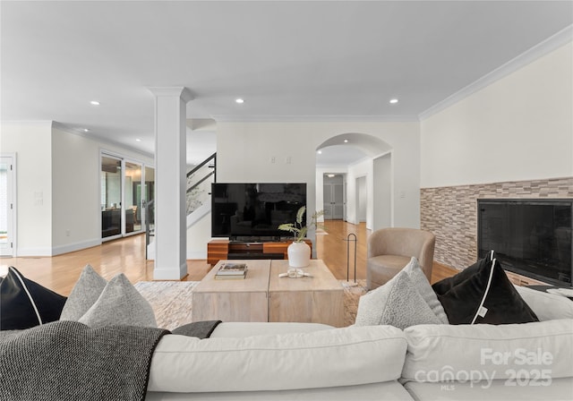 8300 Fairview Rd, Charlotte, NC 28226 - living room featuring wood finished floors, ornamental molding, stairs, recessed lighting, and arched walkways
