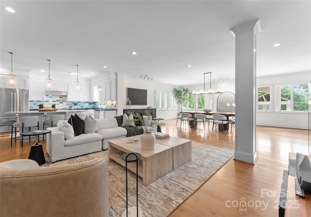 8300 Fairview Rd, Charlotte, NC 28226 - living area with recessed lighting, light wood-style floors, and a chandelier