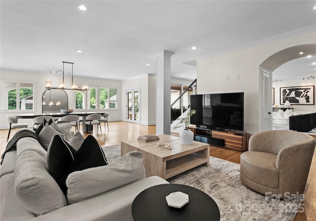 8300 Fairview Rd, Charlotte, NC 28226 - living area with light wood-style flooring, plenty of natural light, recessed lighting, arched walkways, and stairway