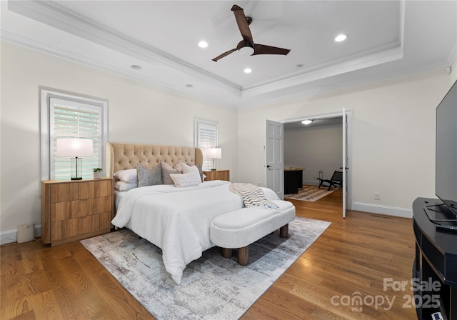 8300 Fairview Rd, Charlotte, NC 28226 - bedroom featuring ornamental molding, a raised ceiling, wood finished floors, baseboards, and ceiling fan