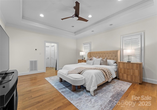 8300 Fairview Rd, Charlotte, NC 28226 - bedroom with a raised ceiling, ornamental molding, light wood finished floors, recessed lighting, and baseboards