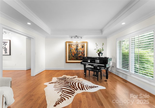 8300 Fairview Rd, Charlotte, NC 28226 - living area with ornamental molding, a raised ceiling, wood finished floors, baseboards, and recessed lighting