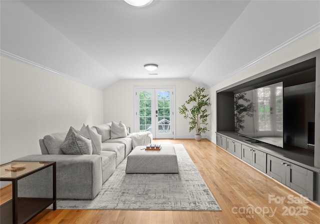 8300 Fairview Rd, Charlotte, NC 28226 - living area featuring lofted ceiling, wood finished floors, and baseboards