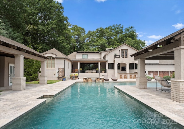 8300 Fairview Rd, Charlotte, NC 28226 - back of house featuring a patio area and an outdoor pool