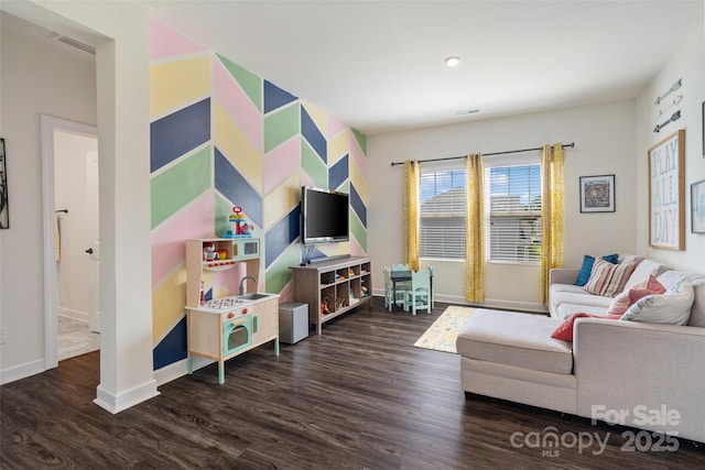 living room featuring wood finished floors and baseboards