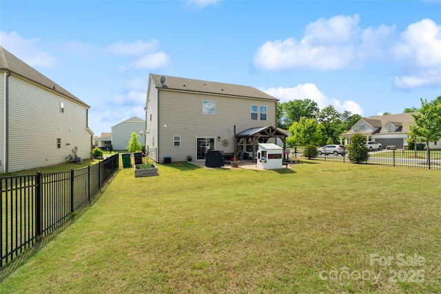 back of property with a gazebo and a patio area