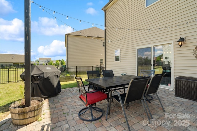 view of patio / terrace with outdoor dining space and a grill